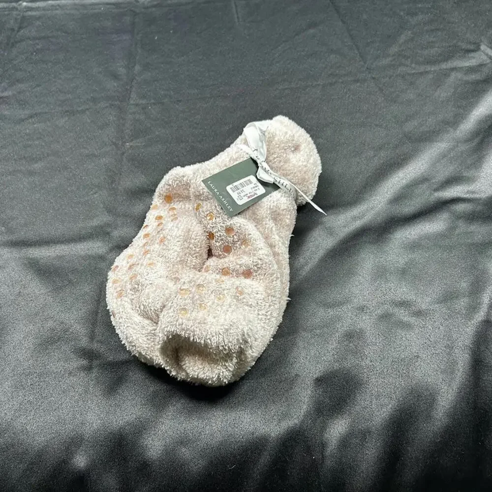 Laura Ashley pink fluffy socks with grips on the bottom.